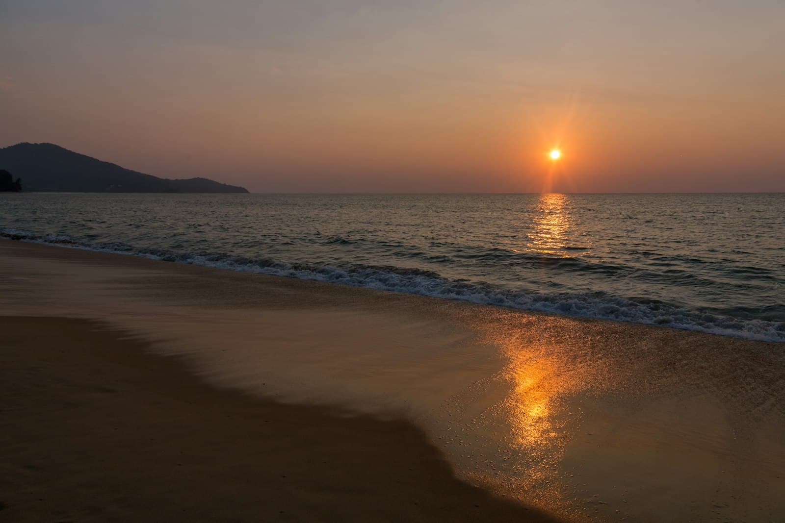 Thailand beach at golden hour with calm turquoise water